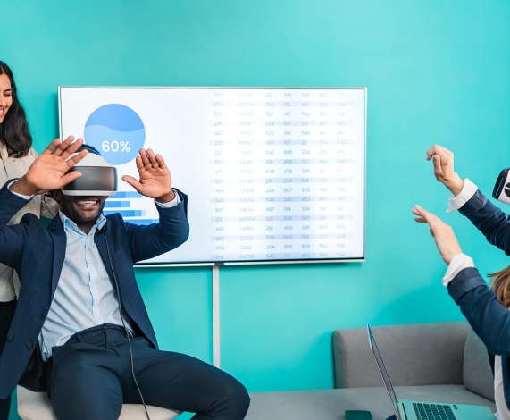 Businessmen in VR glasses watching graphs